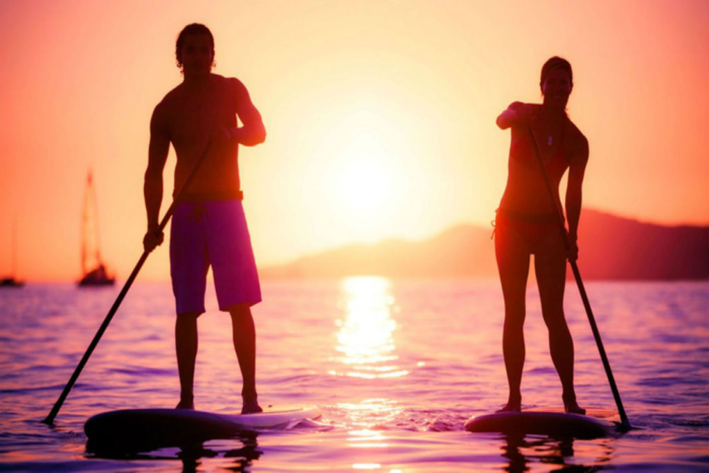 paddle board sunset